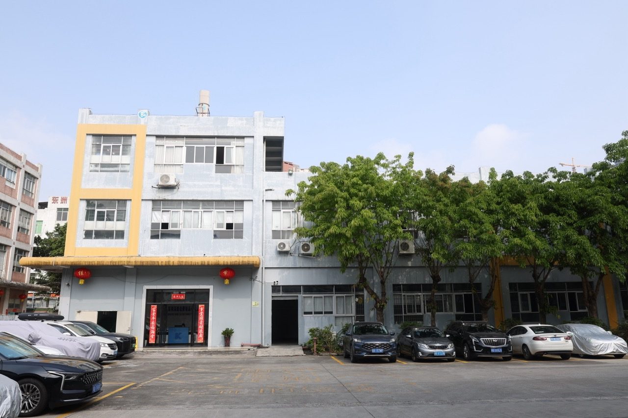 Factory building exterior with front parking area