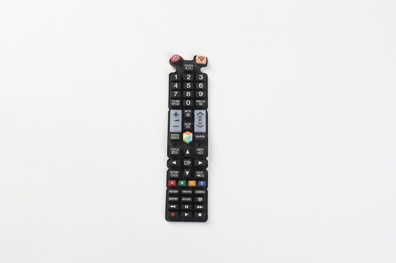 Black remote-control silicone keypad on white background