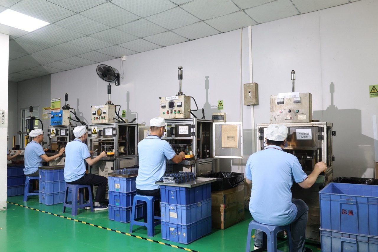 Operators running bench presses on secondary processing line