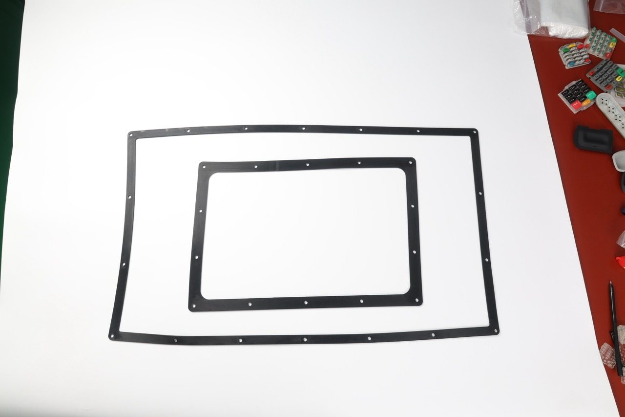 Large rectangular silicone gaskets on white background